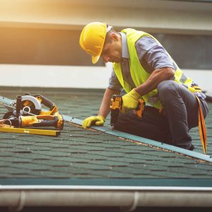 Roofer working in protective work wear gloves,